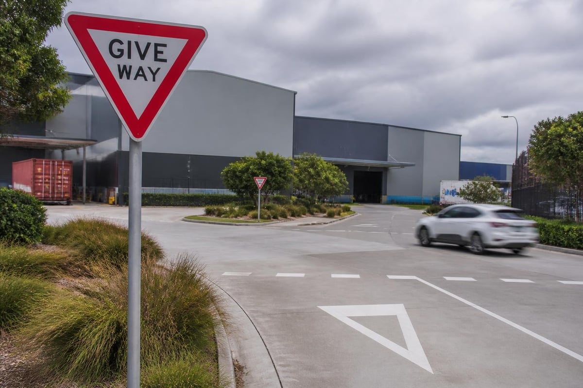 Give way sign facility placement