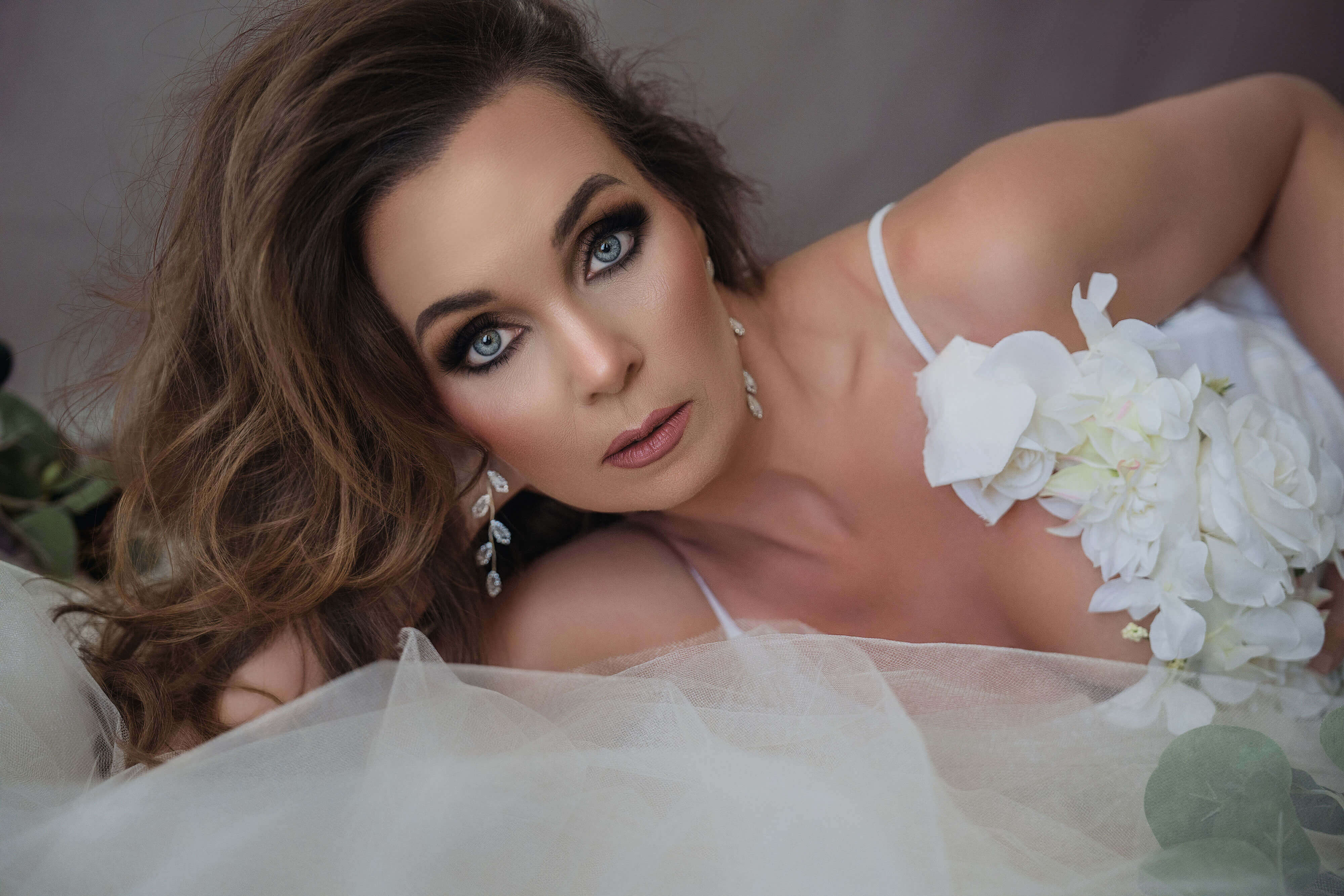 elegant-boudoir-images-for-women-breanne-fine-portraiture-romantic-flowers-birmingham-0032.jpg Classy and Elegant boudoir photo of brunette woman with dramatic sultry eyes and romantic florals created by Breanne Cook of Breanne Fine Portraiture in Birmingham Alabama.