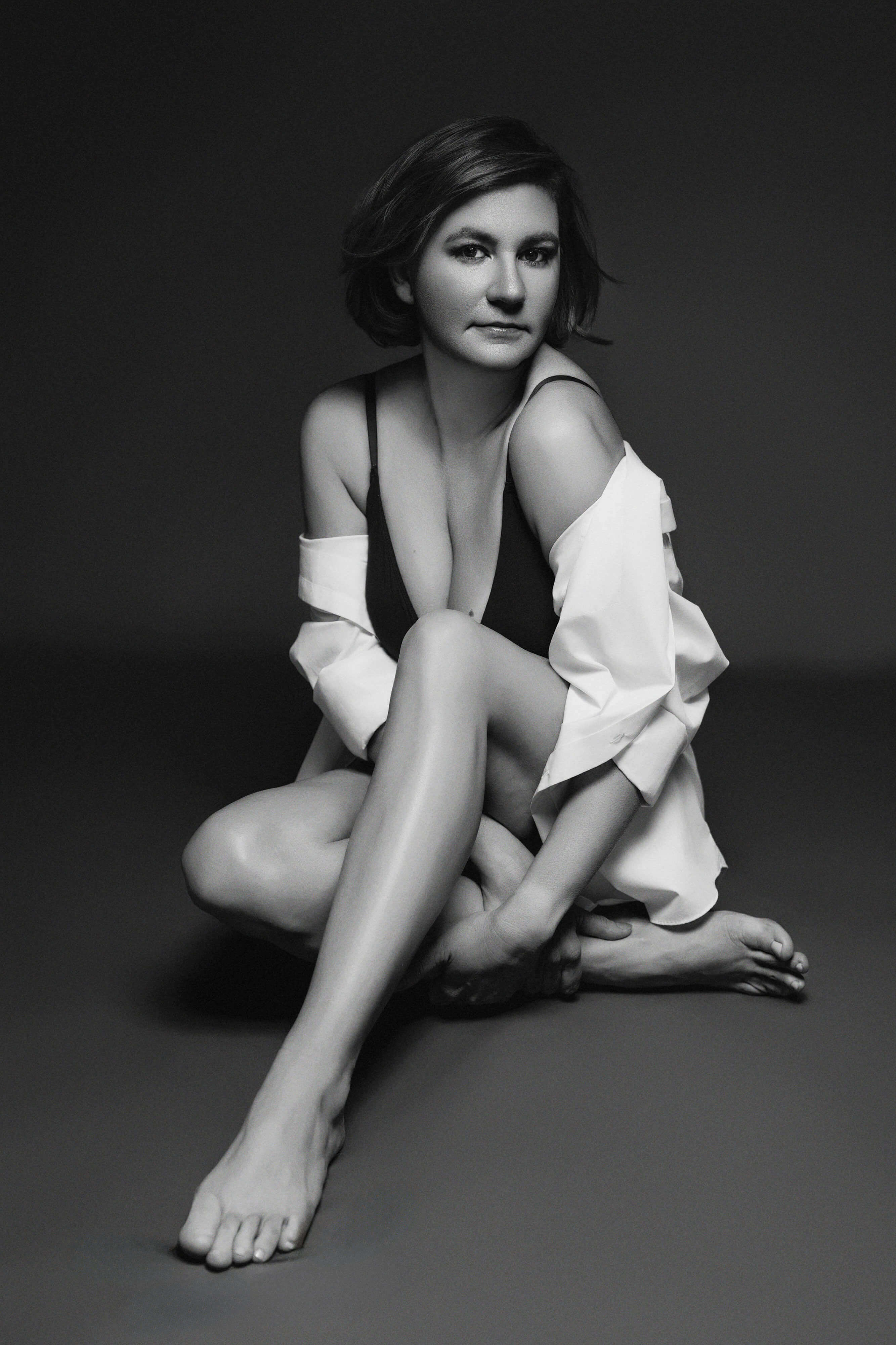 elegant-boudoir-images-for-women-breanne-fine-portraiture-white-shirt-birmingham-0024.jpg Classy and Elegant boudoir portrait photography in black and white of a women over 40 wearing a men's white shirt and black calvin klein bralette by Breanne Cook of Breanne Fine Portraiture in Birmingham Alabama.