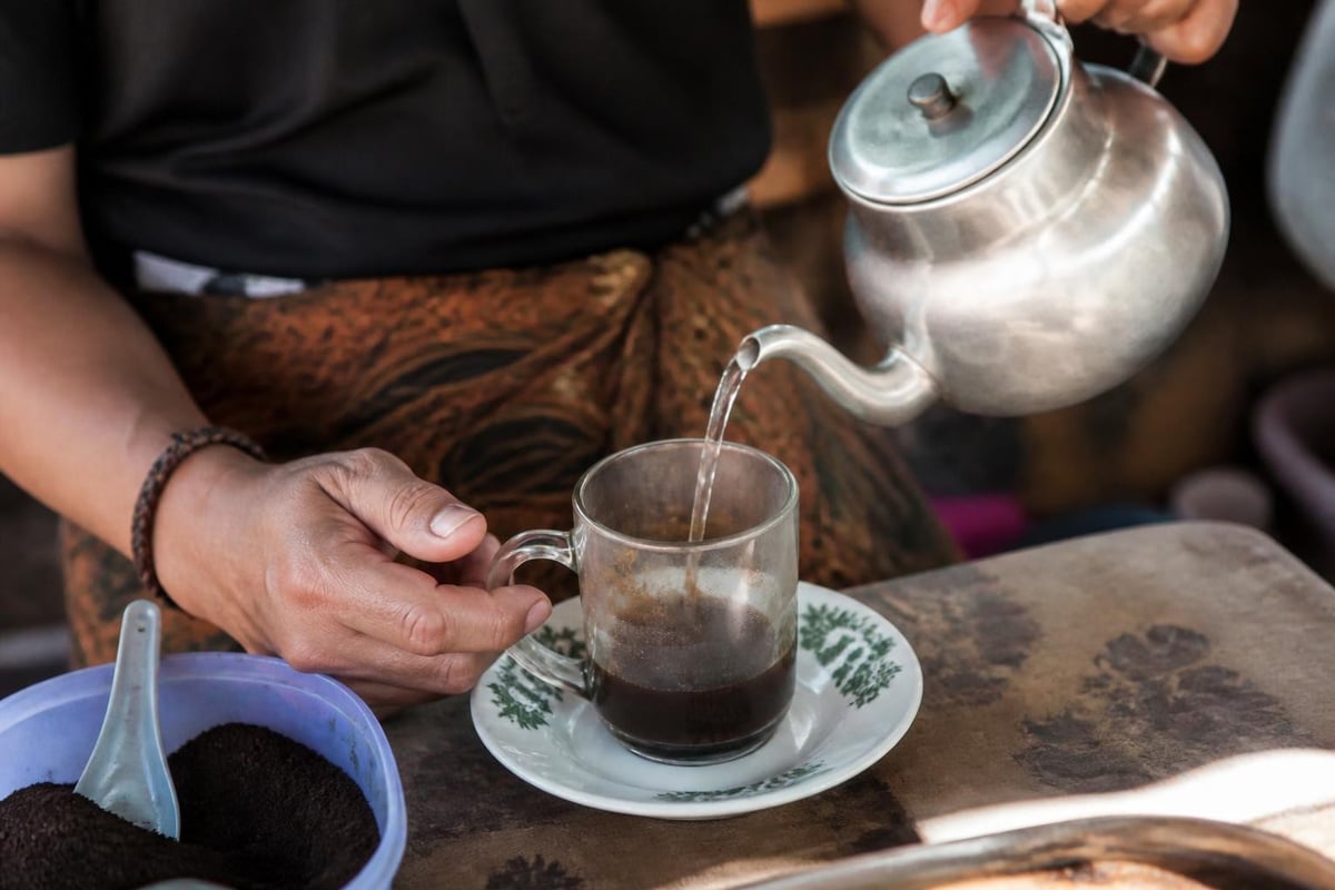 Traditional coffee preparation at sengka kopi