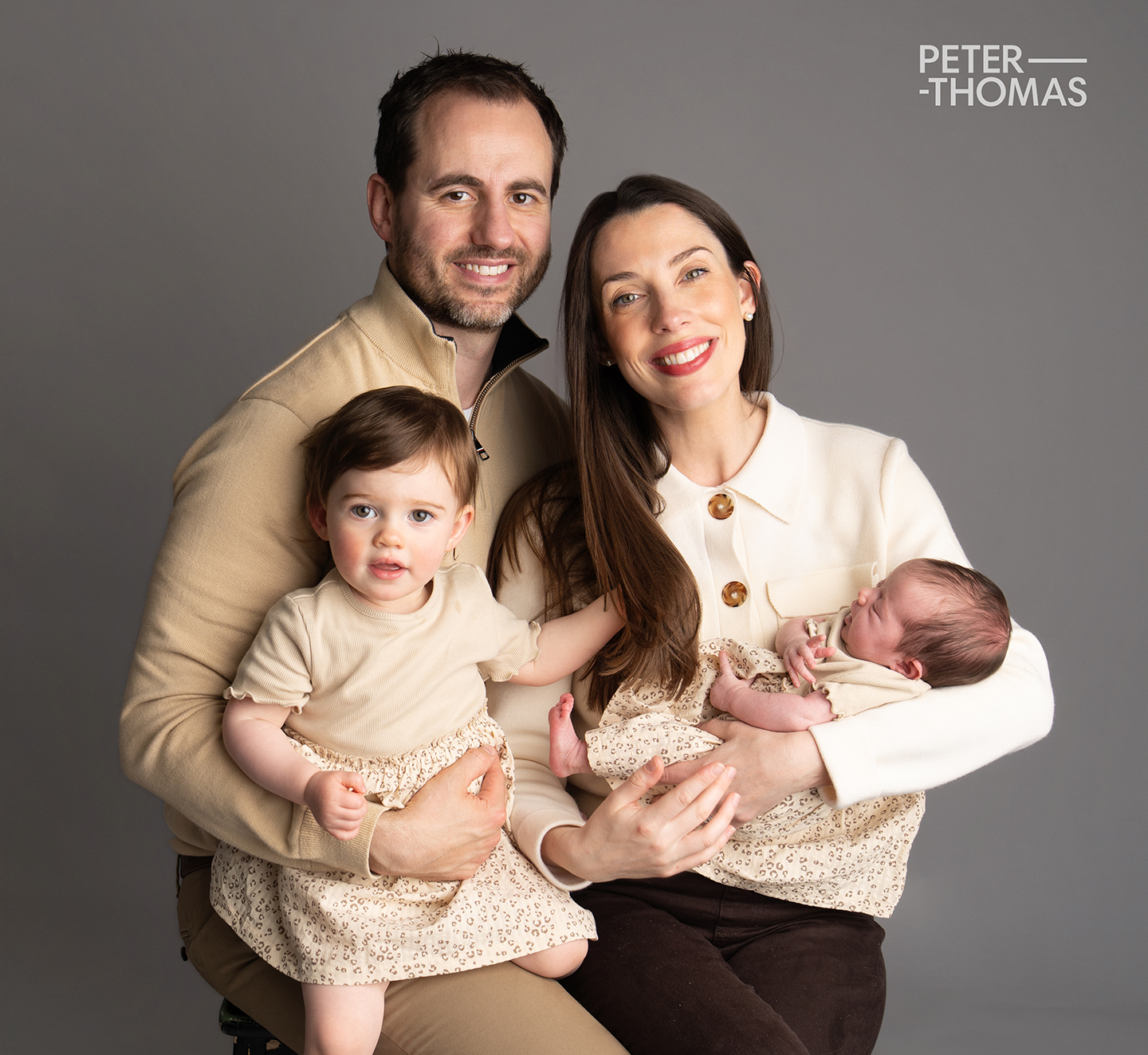 Sibling with her new sister - photographed at Peter Thomas Photography