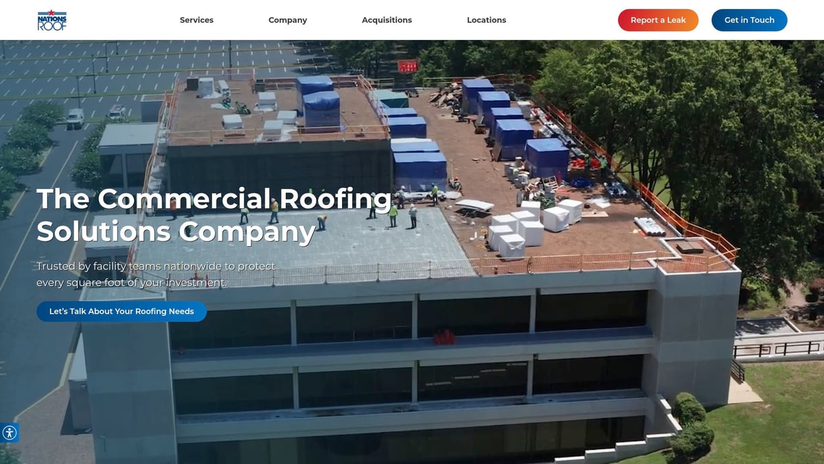 Aerial view of commercial roofing project by Nations Roof, showcasing workers on a flat roof, construction materials, and safety equipment, emphasizing their expertise in scalable roofing solutions for large properties.
