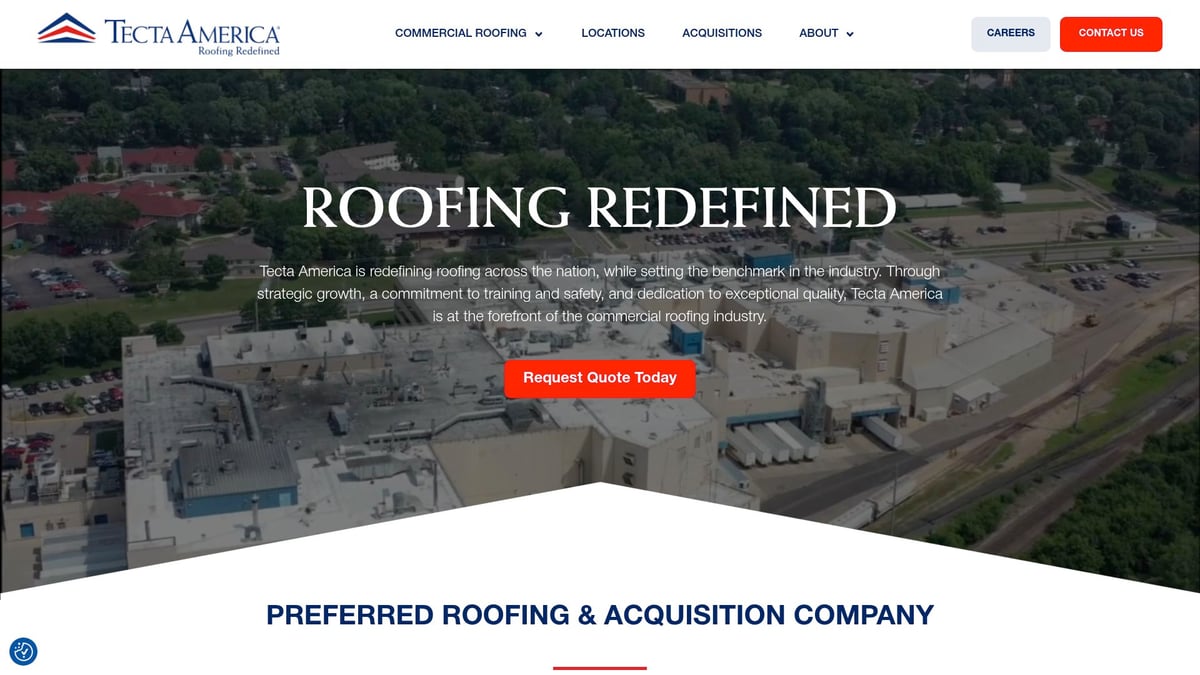 Aerial view of Tecta America commercial roofing facility showcasing extensive flat roofs and surrounding landscape, representing their expertise in large-scale roofing projects and services.